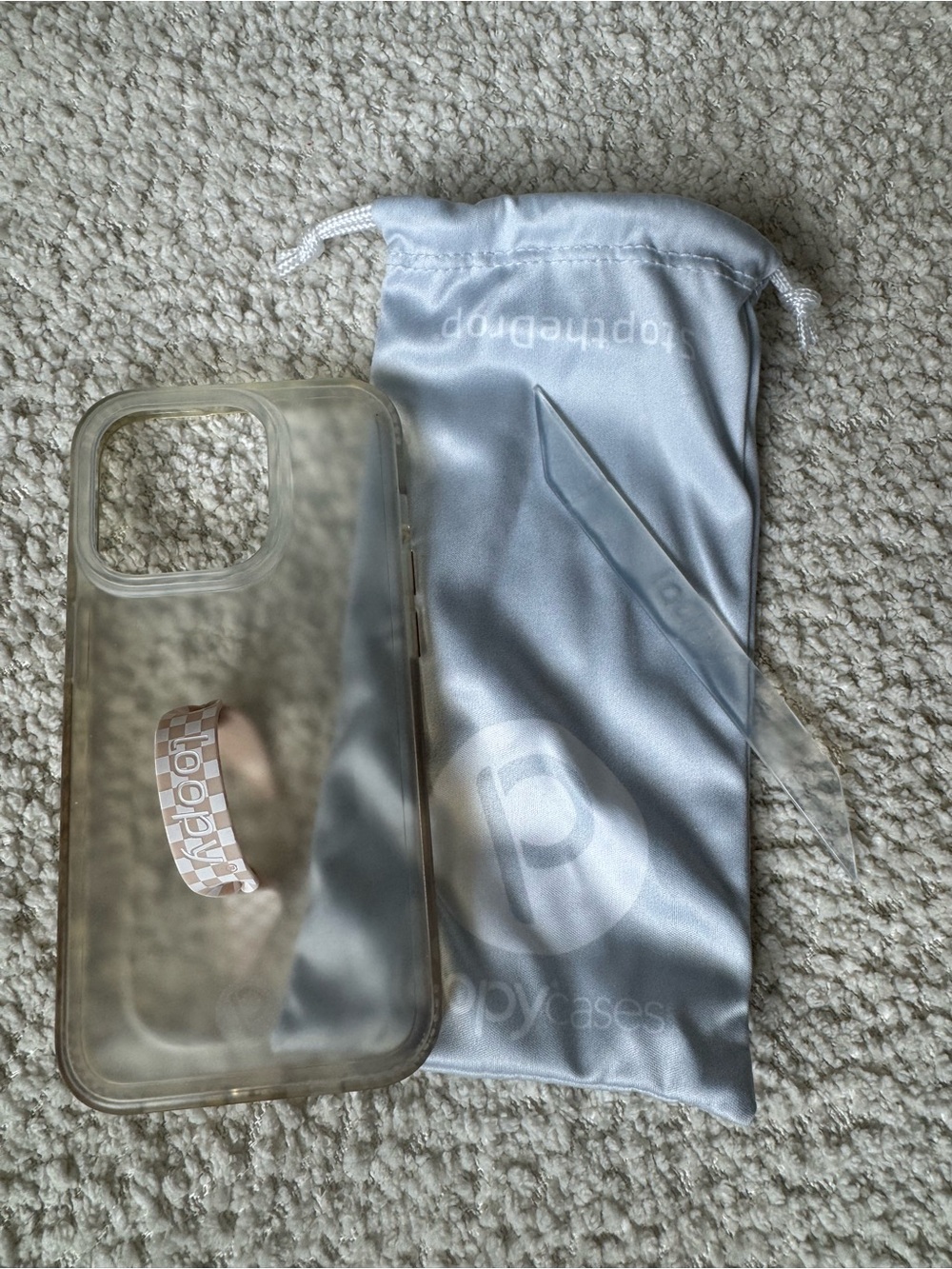 Loopy case for iPhone 15 pro. Clear case with Checker loop and clear loop